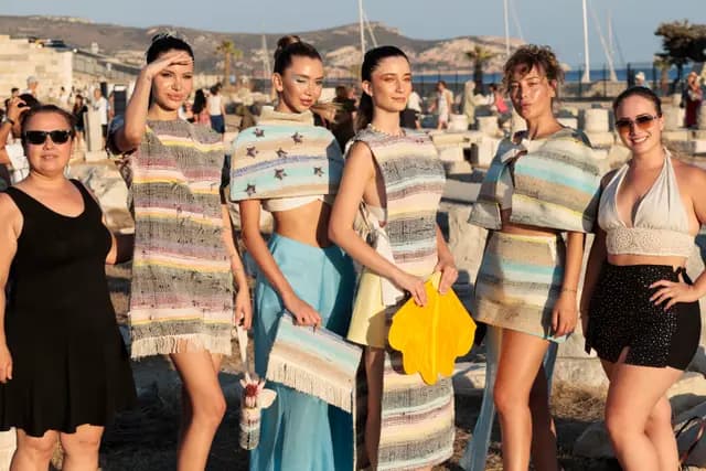 The collection's models and team line up together for a photograph at Knidos.